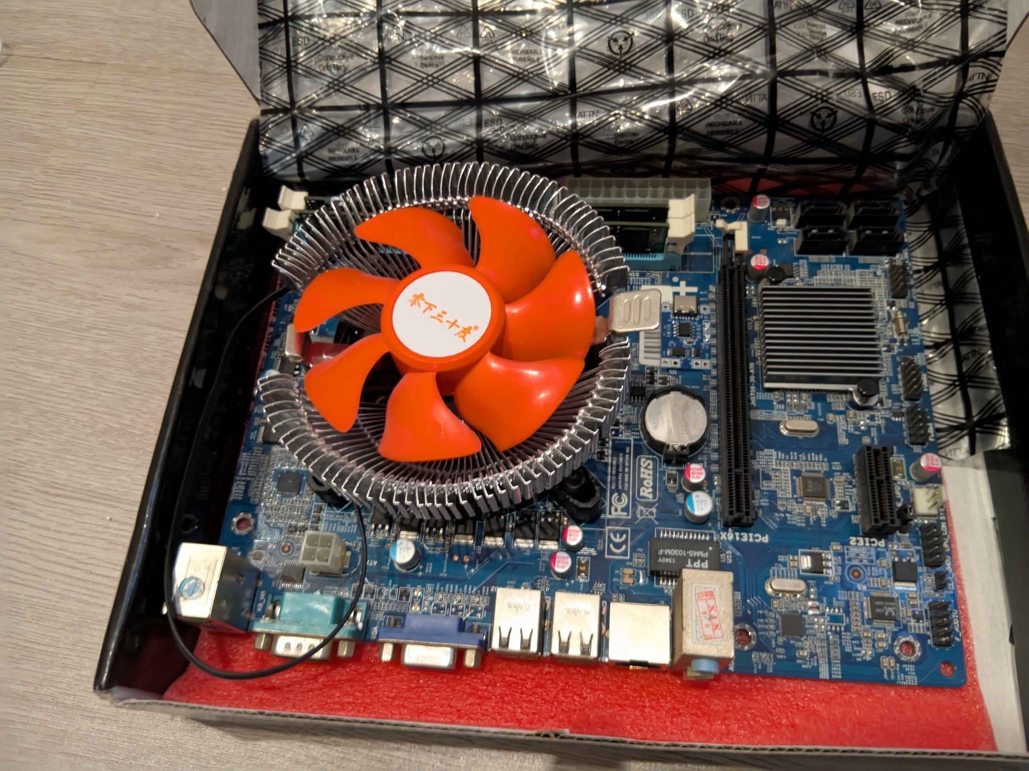 Motherboard with cooler, in box
