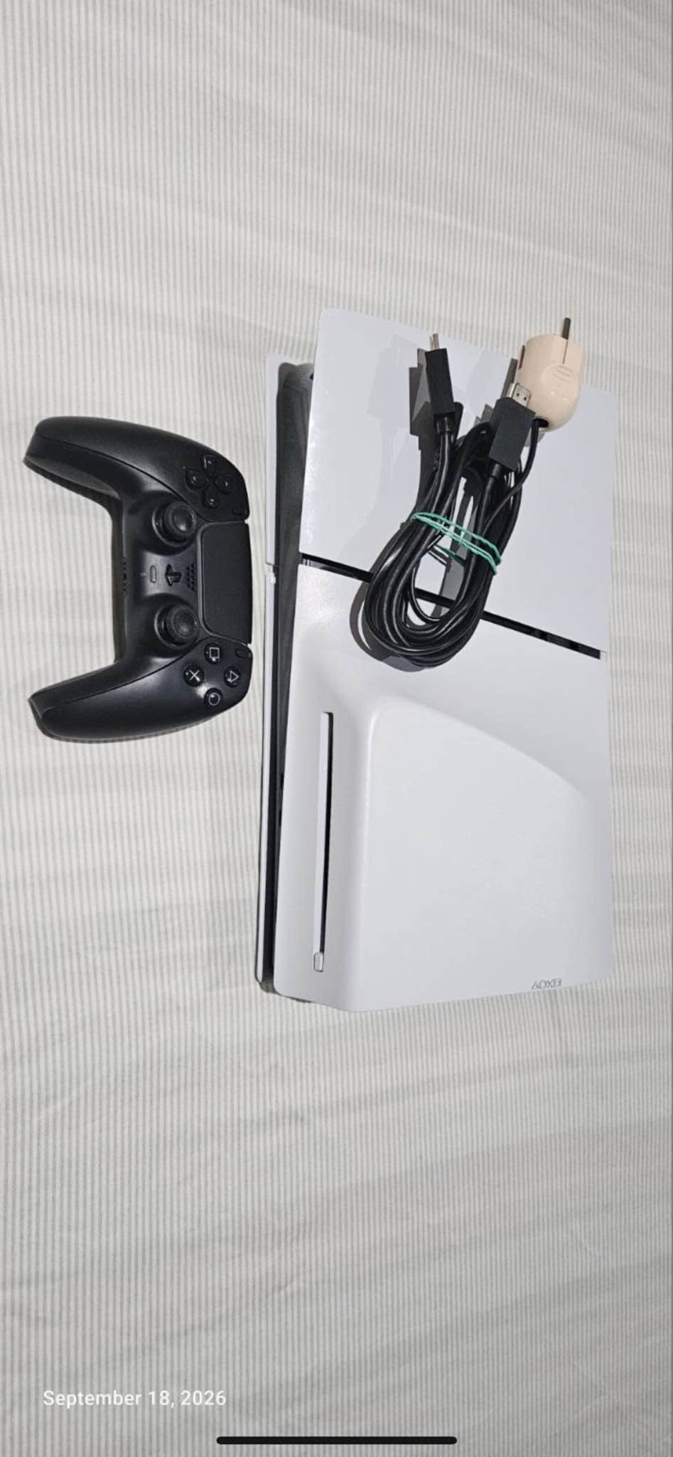 PlayStation 5 Slim disc, with controller