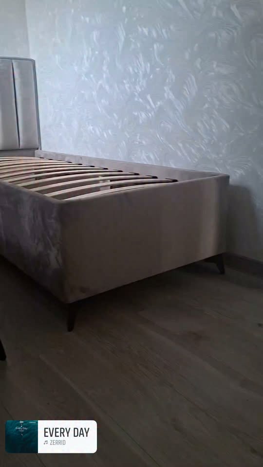 Upholstered bed with slatted base