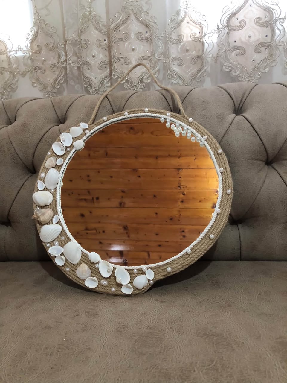 Round mirror with shells and rope frame