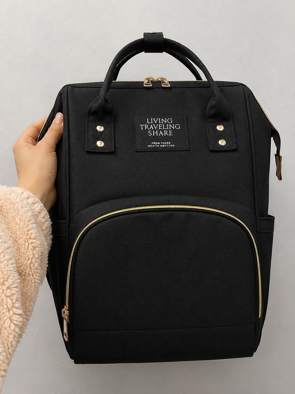 Black backpack with golden zipper