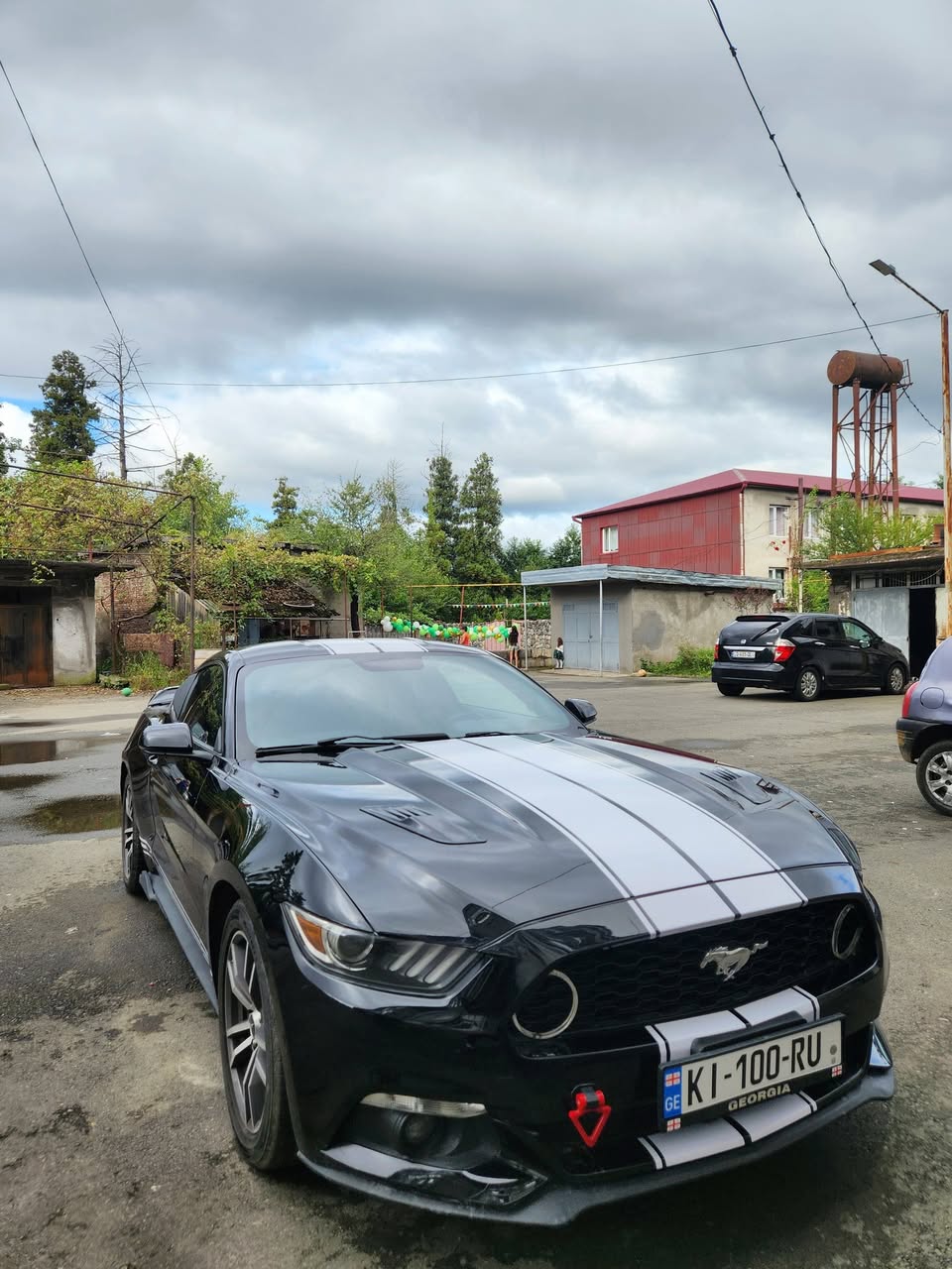 He buys a Ford Mustang, 2015 model, 2.3L, $11,500.