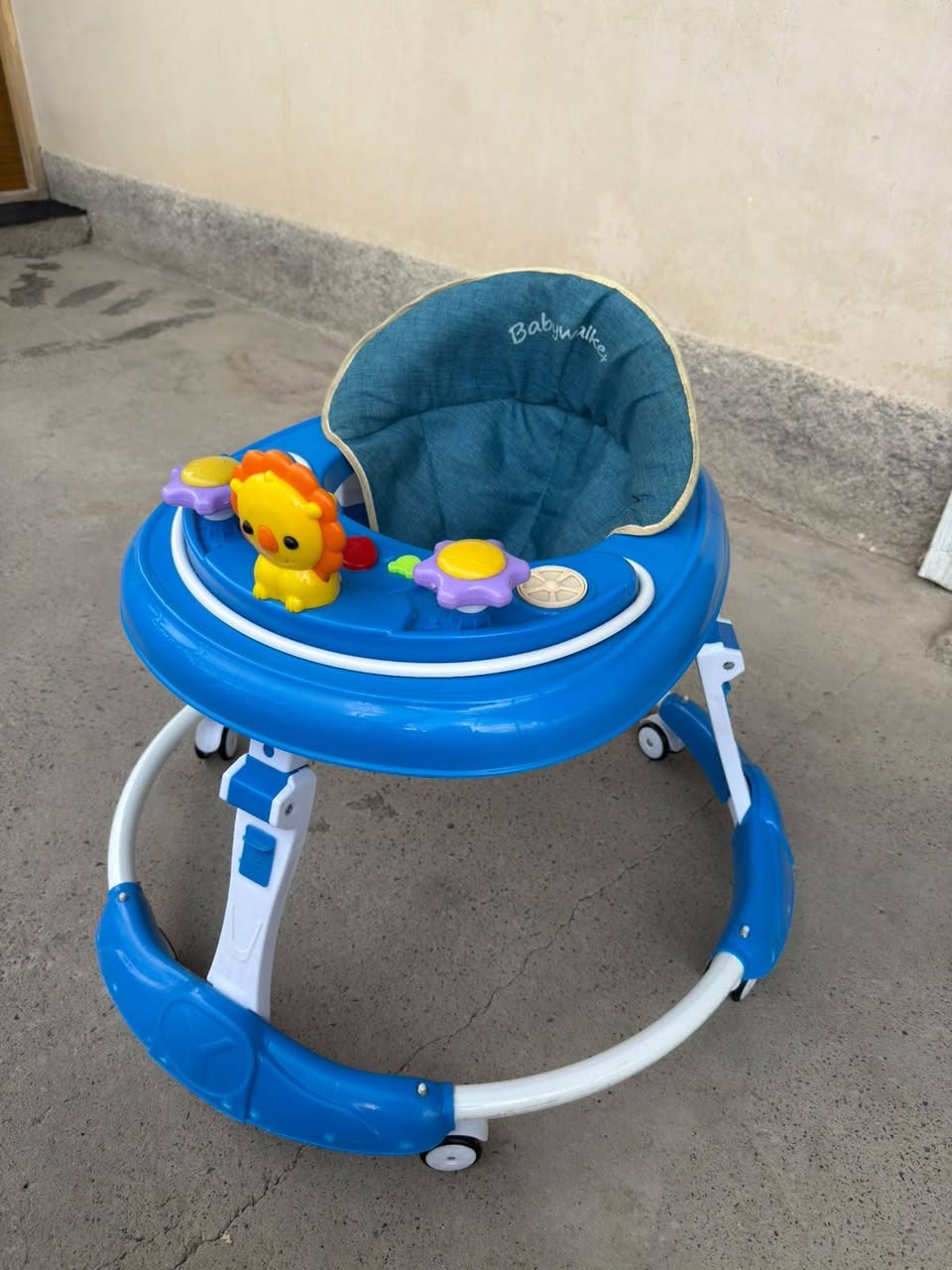 Blue baby walker with toys