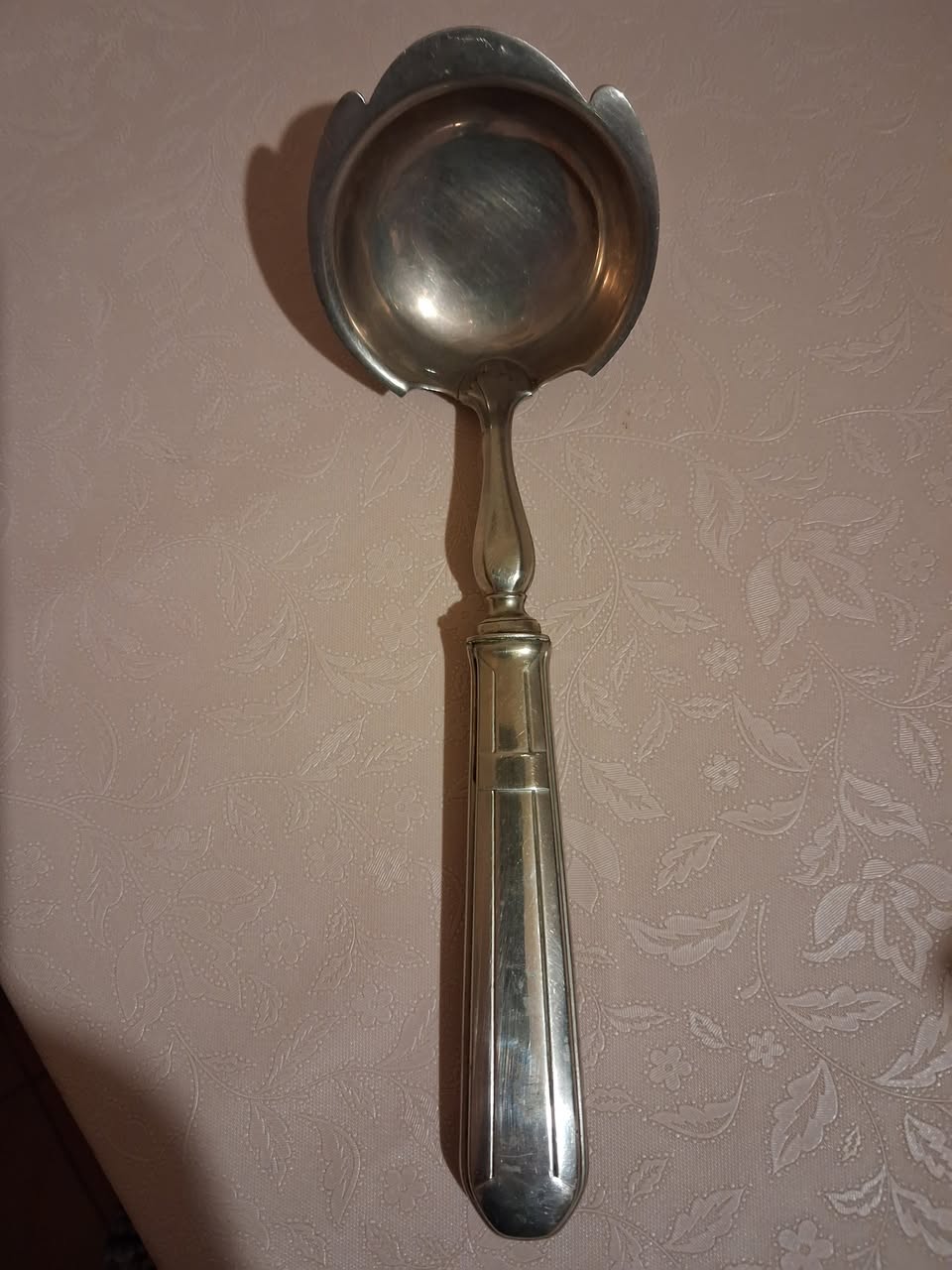 Metal serving ladle with long handle