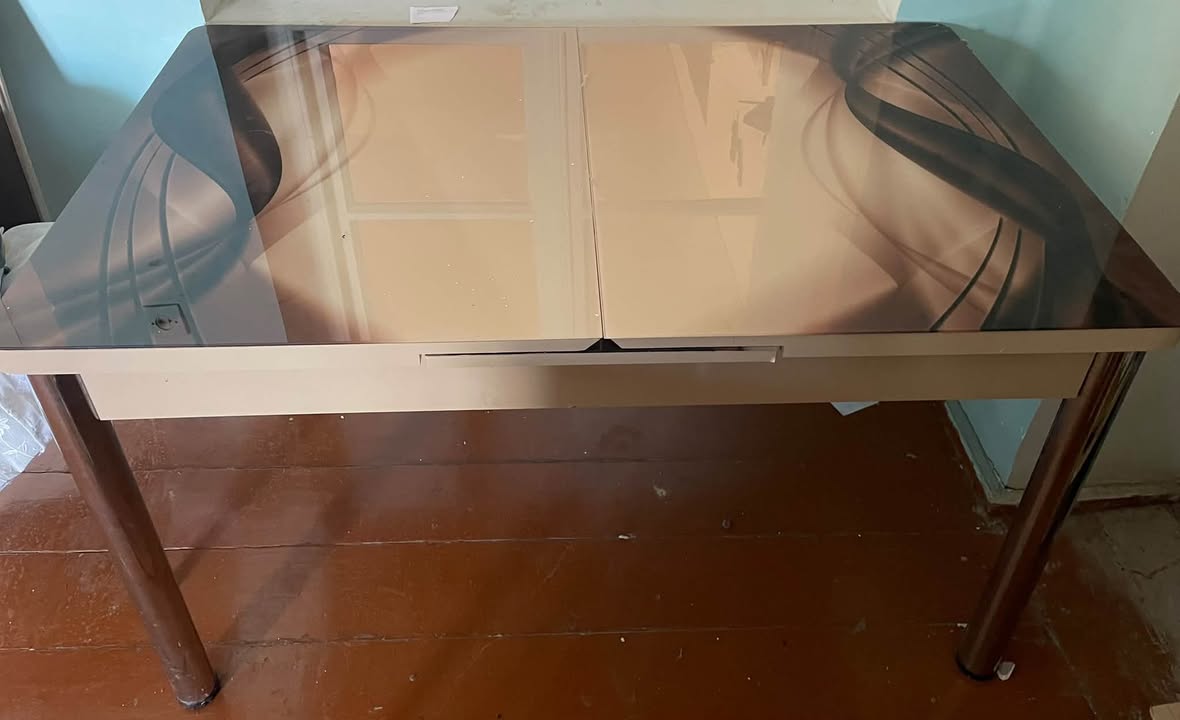 Glass-top dining table with six chairs