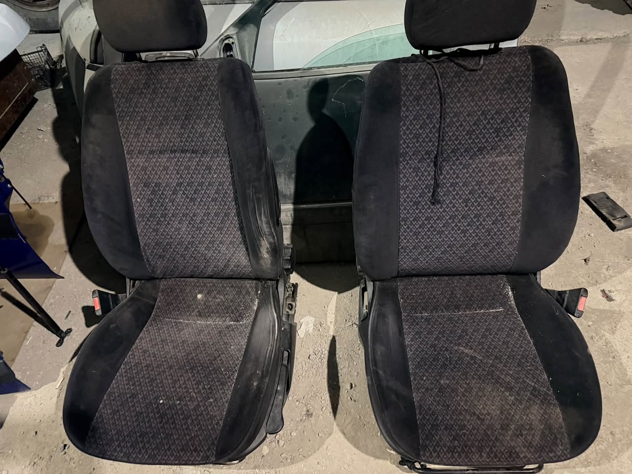 Pair of black fabric car seats