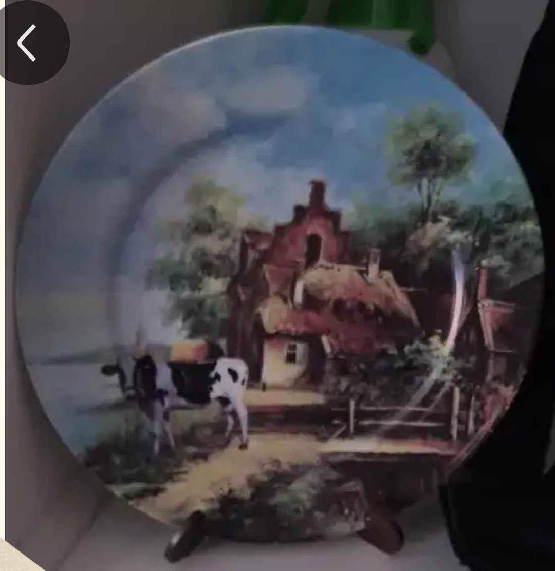 Decorative painted wall plate with a farm scene