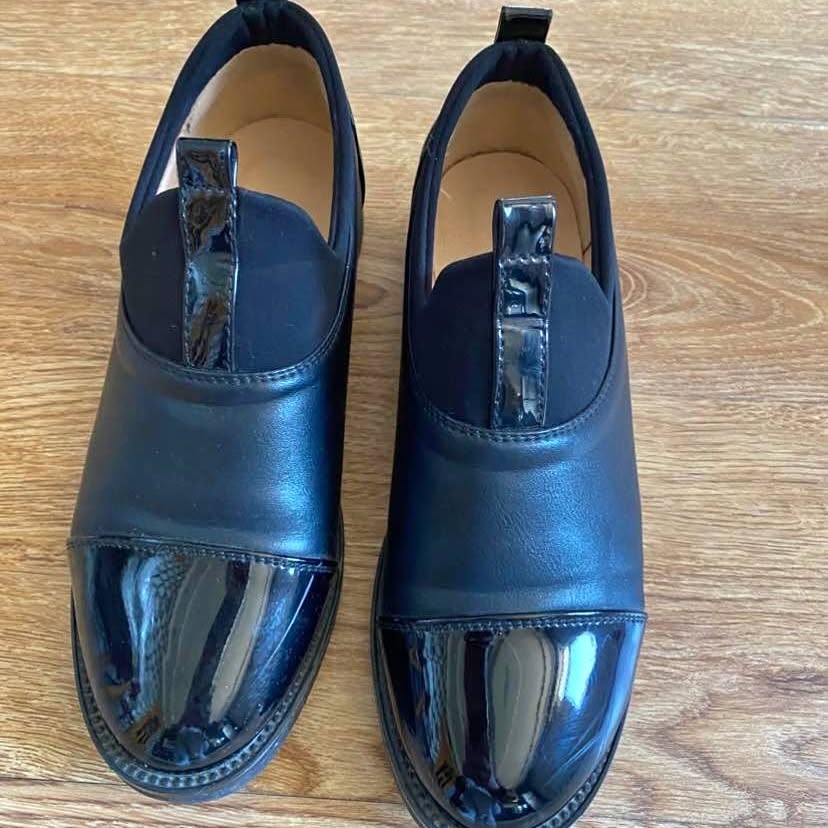 Black leather loafers with patent toe