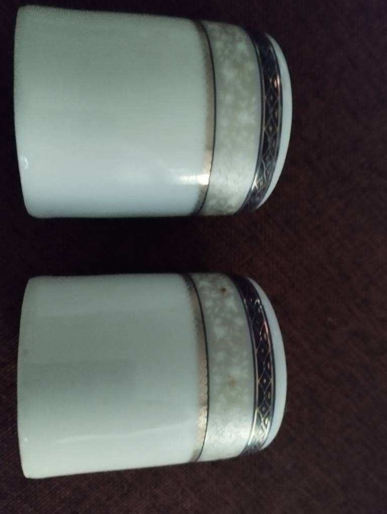 Pair of porcelain cups, silver band