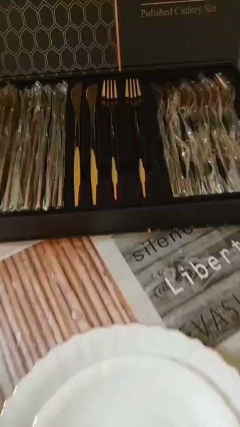 Polished cutlery set, black and gold