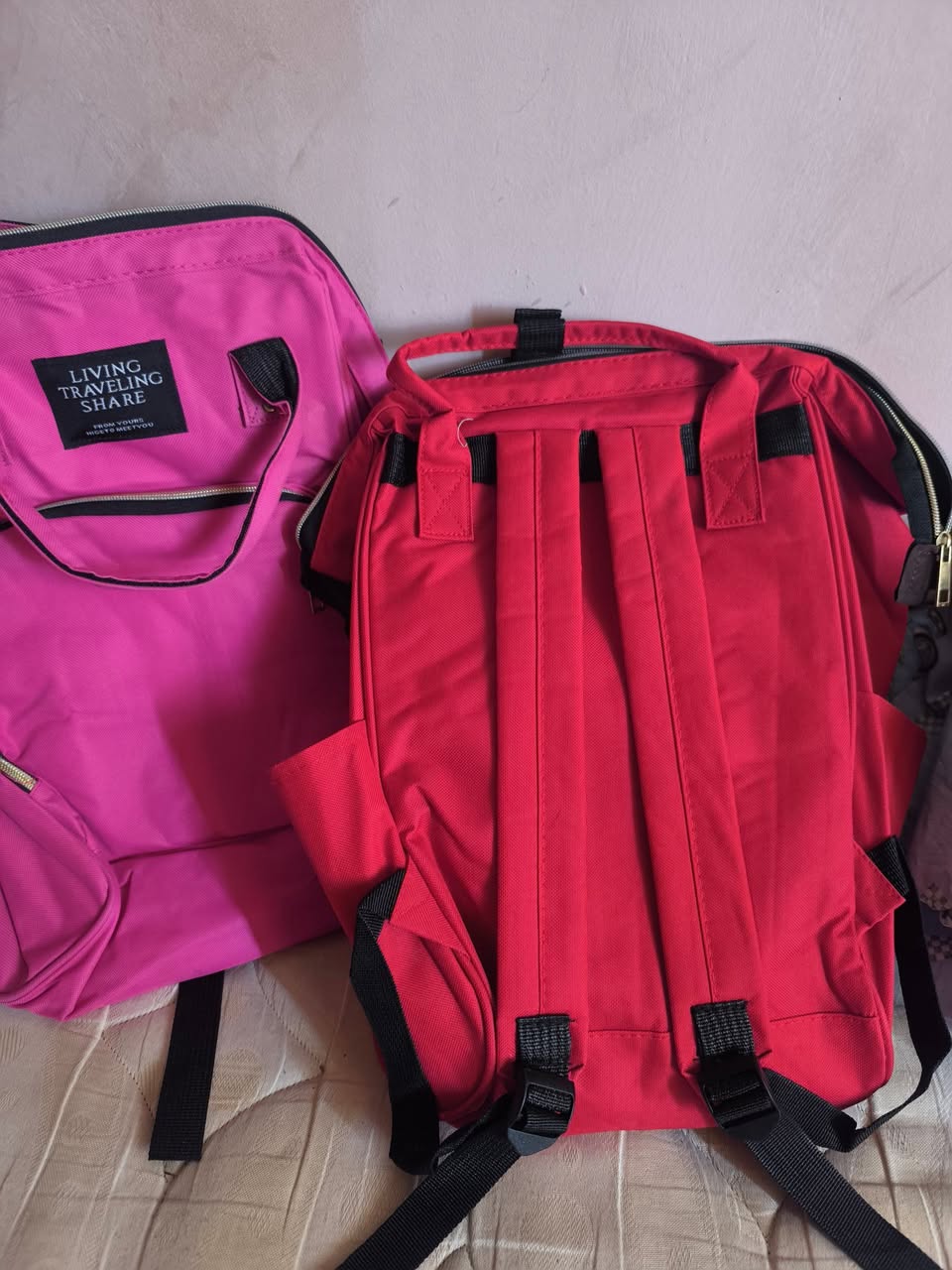 Backpacks, pink and red