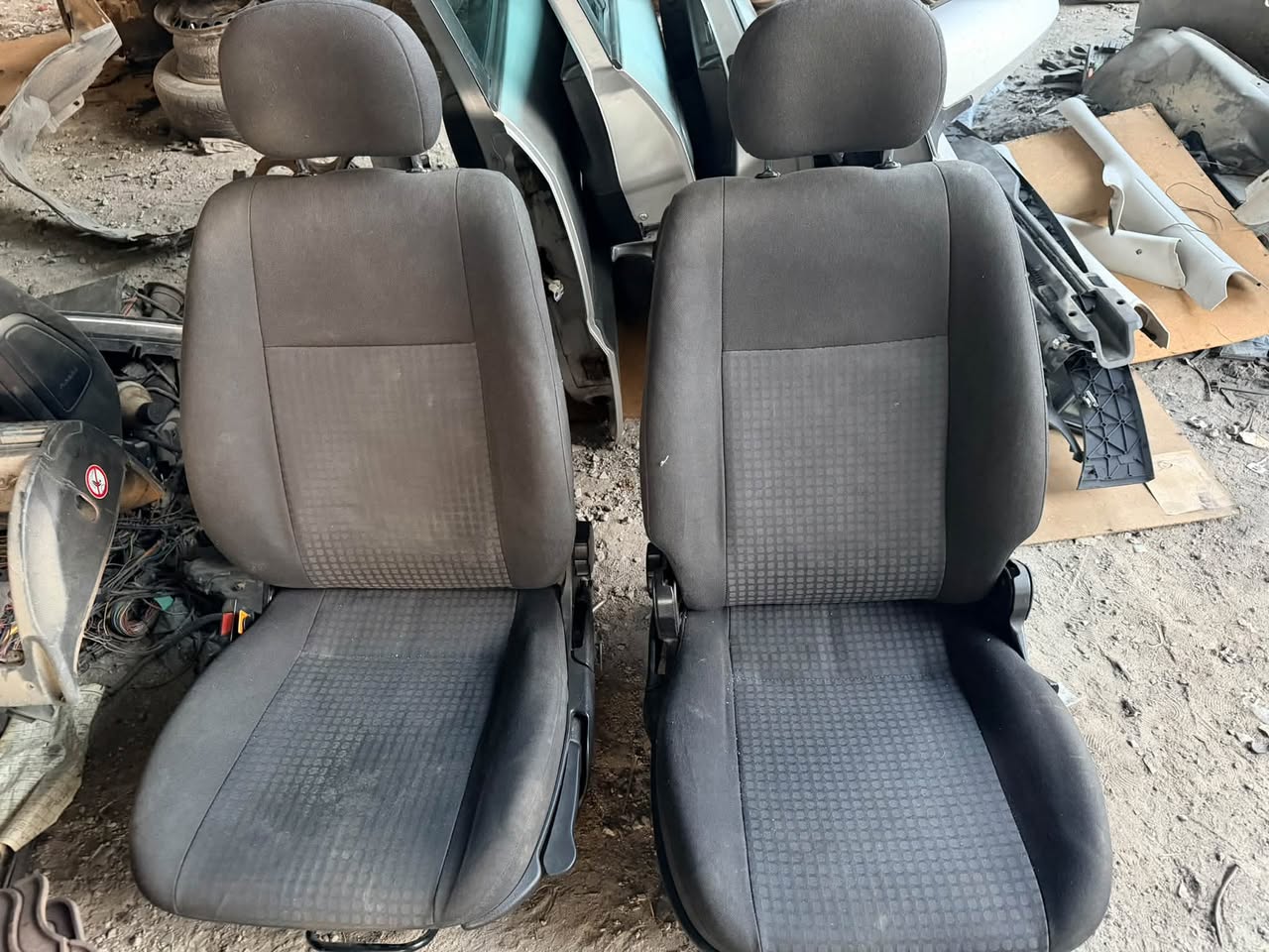 Pair of front car seats, dark fabric