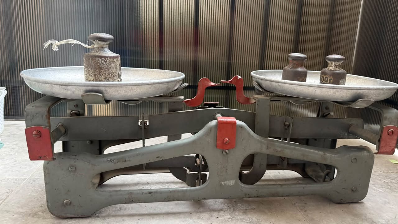 Vintage balance scale with iron weights