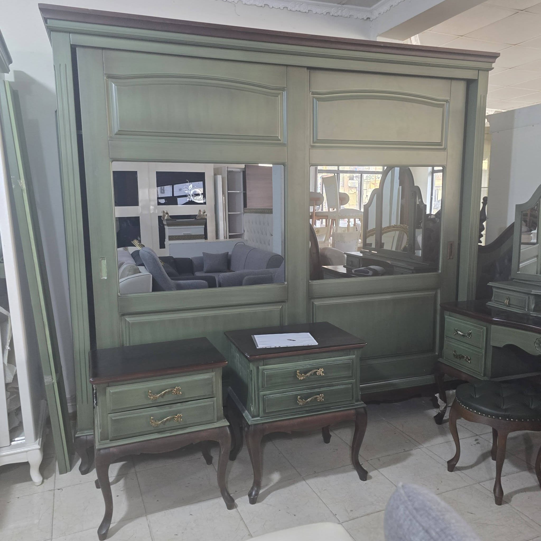 Green wardrobe with mirrors and nightstands
